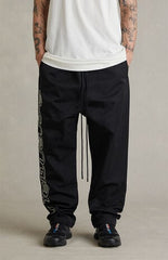 Fear of God ESSENTIALS Vintage Black Active Trace Relaxed Track Pants