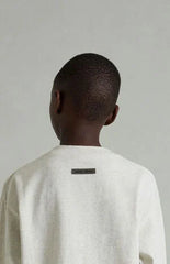 Fear of God ESSENTIALS Kids Heather Oatmeal Classic Long Sleeve T-Shirt